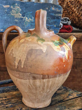 Load image into Gallery viewer, Antique French Cruche Water Jug Rustic Provence Farmhouse country Pottery sitting on blue painted farmhouse chair with a large unpainted Swedish ships trunk behind with a rustic French basket filled with dried roses on top in the Dusty Gems interiors Nantwich shop 