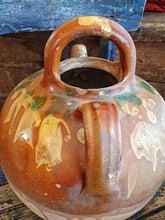 Load image into Gallery viewer, Antique French Cruche Water Jug Rustic Provence Farmhouse country Pottery sitting on blue painted farmhouse chair with a large unpainted Swedish ships trunk behind with a rustic French basket filled with dried roses on top in the Dusty Gems interiors Nantwich shop