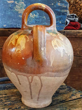 Load image into Gallery viewer, Antique French Cruche Water Jug Rustic Provence Farmhouse country Pottery sitting on blue painted farmhouse chair with a large unpainted Swedish ships trunk behind with a rustic French basket filled with dried roses on top in the Dusty Gems interiors Nantwich shop