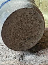 Load image into Gallery viewer, bottom of  Betschdorf confit pot sitting on a low, weathered rustic farmhouse stool. 