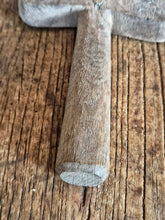 Load image into Gallery viewer, Antique Hungarian oak chopping board with a distinctive tulip-shaped outline and long handle, displayed with cheese and rustic food on a weathered wooden table. The solid oak board has a few historic cutting scars and natural aged wood texture. The board measures 13 inches (33 cm) long including the handle, resting on a weathered wood plank background.