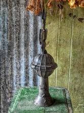 Load image into Gallery viewer, Late 18th century French provincial tinned altar cross with trefoil terminals and radiating glory standing on a rustic green painted wooden table against weathered painted boards and dried flowers.