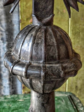 Load image into Gallery viewer, Late 18th century French provincial tinned altar cross with trefoil terminals and radiating glory standing on a rustic green painted wooden table against weathered painted boards and dried flowers.