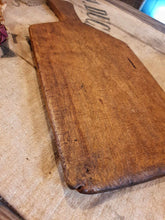 Load image into Gallery viewer, Antique French Rustic Farmhouse Bread Board Cutting Board sitting on top of a French Linen Flour sack on top of a primitive wooden french farm house table in the Dusty Gems Interiors Nanntwich shop