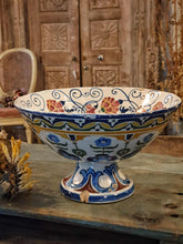 Load image into Gallery viewer, Antique Italian Deruta majolica bowl (yellow, blue, green) sitting on a rustic duck egg blue chopping board next to a bunch of dried sunflowers. The display is set on a weathered French workbench against a large, bleached-out Indian door.