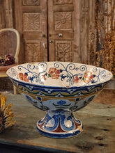Load image into Gallery viewer, Antique Italian Deruta majolica bowl (yellow, blue, green) sitting on a rustic duck egg blue chopping board next to a bunch of dried sunflowers. The display is set on a weathered French workbench against a large, bleached-out Indian door.