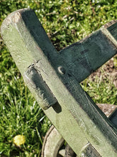 Load image into Gallery viewer, A 66-inch late 19th-century antique French wheelbarrow in weathered green paint, featuring slatted timber construction and forged ironwork.