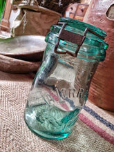 Load image into Gallery viewer, vintage La Lorraine French Half Liter storage jar French country  kitchen sitting on french country table on old french linen sack french rustic interior Dusty Gems interiors best french country items 