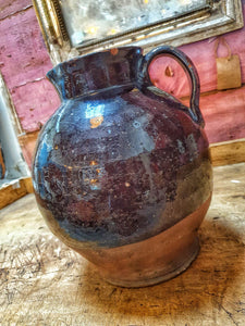 Antique Welsh Buckley Black Pottery Jug Rustic vernacular North wales flintshire jug sitting ontop of swedish painted marrage chest with french vintage linen in the background on french farmhouse rustic shelving in the dusty Gems interiors shop