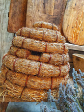 Load image into Gallery viewer, Traditional French Country Bee Skep Rustic Primitive Farmhouse sitting on antique french farmhouse bench with a bucket of cut lavender in a vintage tin rivited bucket . french farmhouse cutting boards and chopping board in the back ground. Dusty gems Interiors Nantwich