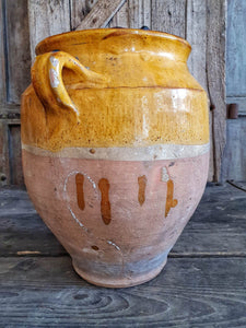 Antique French Large Confit pot Rustic Farmhouise mustard Glaze  Terracotta body sitting infront of french country primitive wooden shutters in the Dusty Gems interiors nantwich shop 