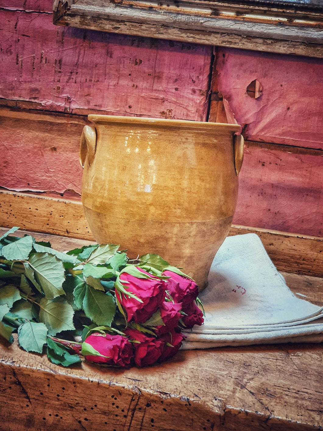 Antique French Confit Pot country  Rustic Farmhouse Pottery 19th century sitting on farmhouse table with red roses and french linen to the front dusty gems interiors nantwich 