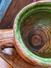 Load image into Gallery viewer, French Antique Rustic Confit Pot primitive Farmhouse kitchen olive pot sitting on french rustic country table with terracotta dairy bowl and large french cutting board and french mint plant in old pot all agaist a background of red painted rusic panel wall with flaking paint dusty gems interiors nantwich