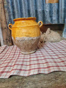 Antique French Country Confit Pot Rustic Farmhouse storage Jar 19th century mustard yellow and Terracotta sitting on antique french linen checked textile. dusty gems interiors nantwich 