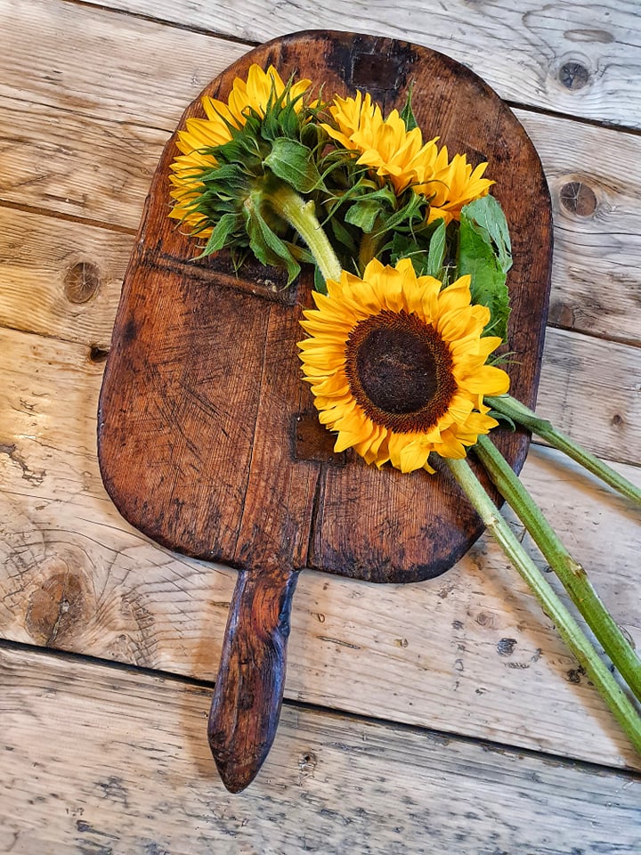 French Farmhouse Chopping Board Charcuterie Pizza Cheese board bread board or baking board for sourdough bread chopping board on french farmhouse table with fresh sunflowers french country rustic kitchen dusty gems interiors nantwich 