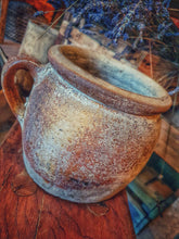 Load image into Gallery viewer, French country Antique Confit pot Rustic Farmhouse primitive olive oil storage jar sitting on french country made wooden farmhouse stool with old antique wooden crates and dried lavender in the background dusty gems interiors nantwich