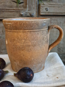 Antique French Country Rustic Terracotta Farmhouse Hand Made Jug sitting on french farmhouse table along with french 19th century linen with four fresh figs on top with a background of painted french farmhouse shutters dusty Gems interiors nantwich