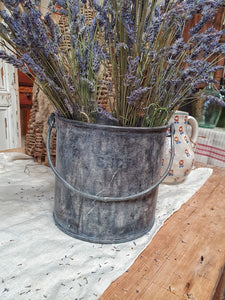 Vintage French Paint Kettle Industrial rustic Modern rustic  filled with fresh lavender on french country kitchen table infront of antique french bee hive and french country pottery. perfect for the cottage core aesthetic dusty gems interiors nantwich 