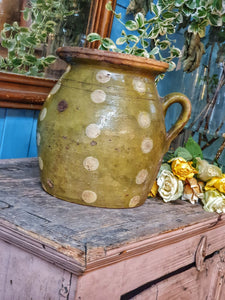 Antique Rustic Hungarian green jug confit pot olive jar  With Folk Art Decoration primitive Farmhouse sitting on antique swedish country pink painted cupboard with 19th century  french mirror behind.Dusty gems interiors nantwich    