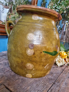 Antique Rustic Hungarian green jug confit pot olive jar  With Folk Art Decoration primitive Farmhouse sitting on antique swedish country pink painted cupboard with 19th century  french mirror behind.Dusty gems interiors nantwich