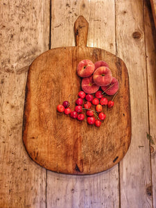 Antique French Country Chopping Board Charcuterie Pizza on french farmhouse table with fruit peaches and cherries cheese board and sourdough bread primitive kitchen dusty gems interiors nantwich 