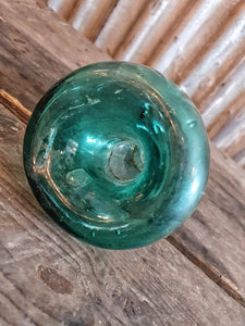 Antique Spanish green  Glass Wasp Trap Rustic French Country cottage Garden sitting on a wooden rustic french farmhouse table with a green glass french storage jar with wellow flowers in it  French country garden dusty gems interiors nantwich
